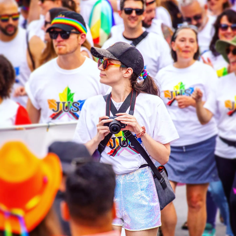 Alex doing photography in the 2023 Pride Parade for the Department of Justice&rsquo;s Advisory Committee on Sexual Orientation and Gender Identity and Expression